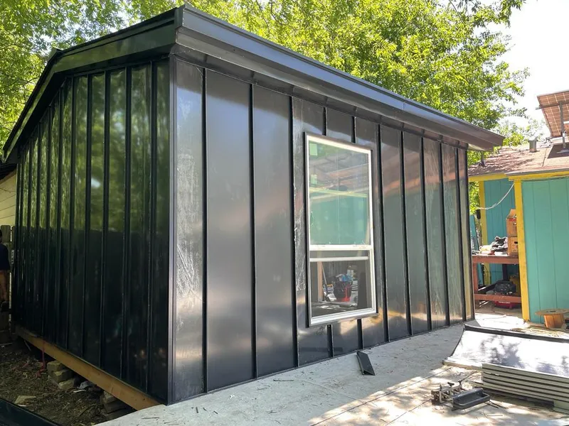 Black standing seam metal wall panels for Roof Inspection in Winchester